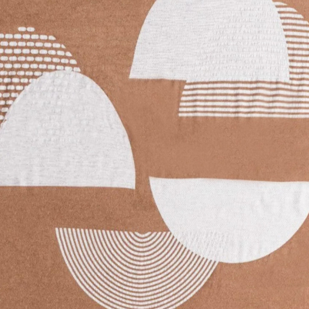 Pattern of white geometric shapes on a brown background