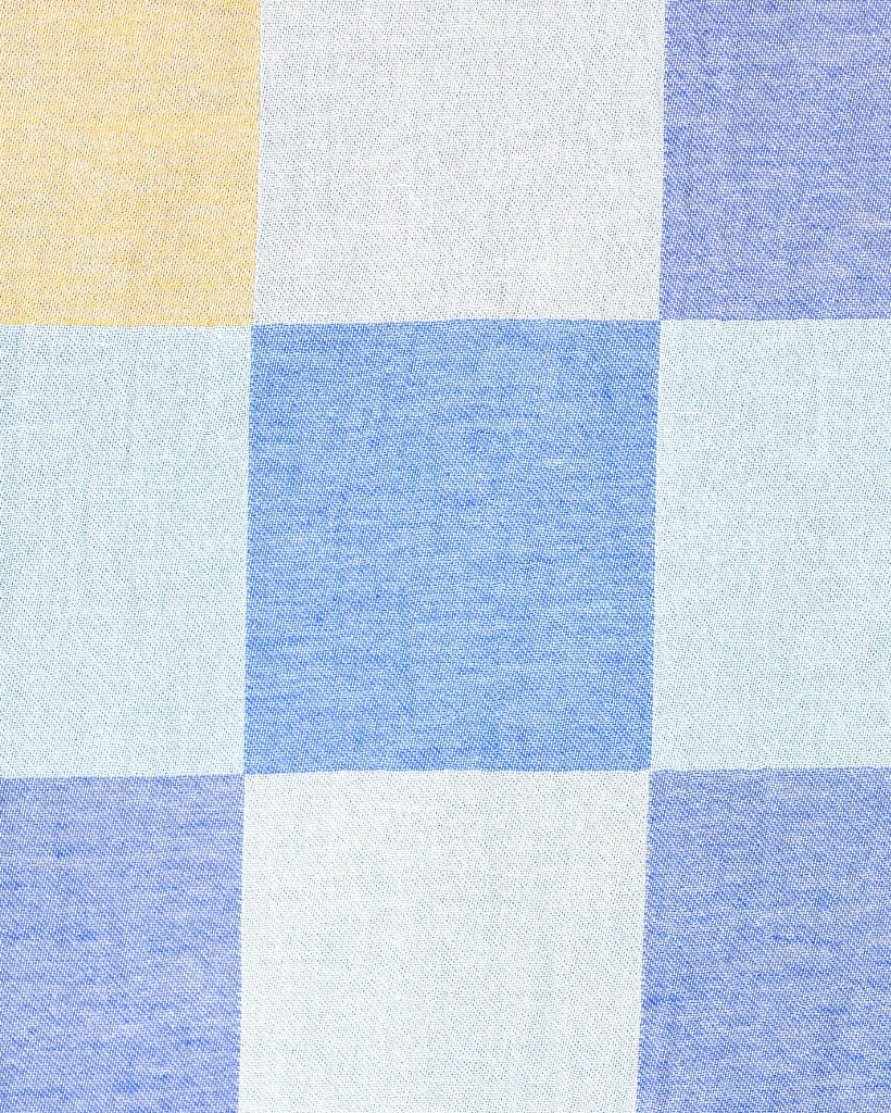 Checkered fabric pattern with blue, white, and yellow squares