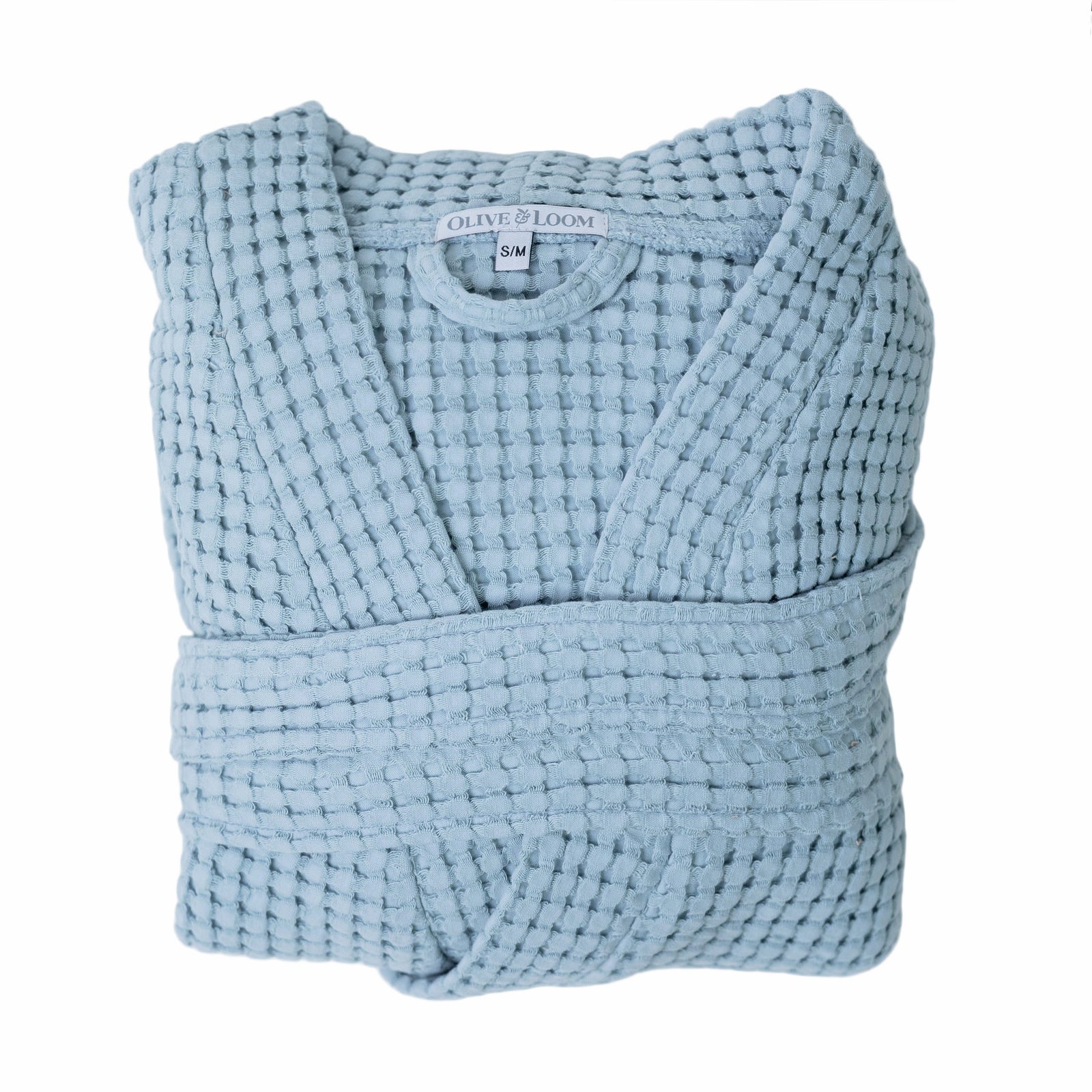 Sky blue waffle robe with a visible olive and loom brand label on a white background