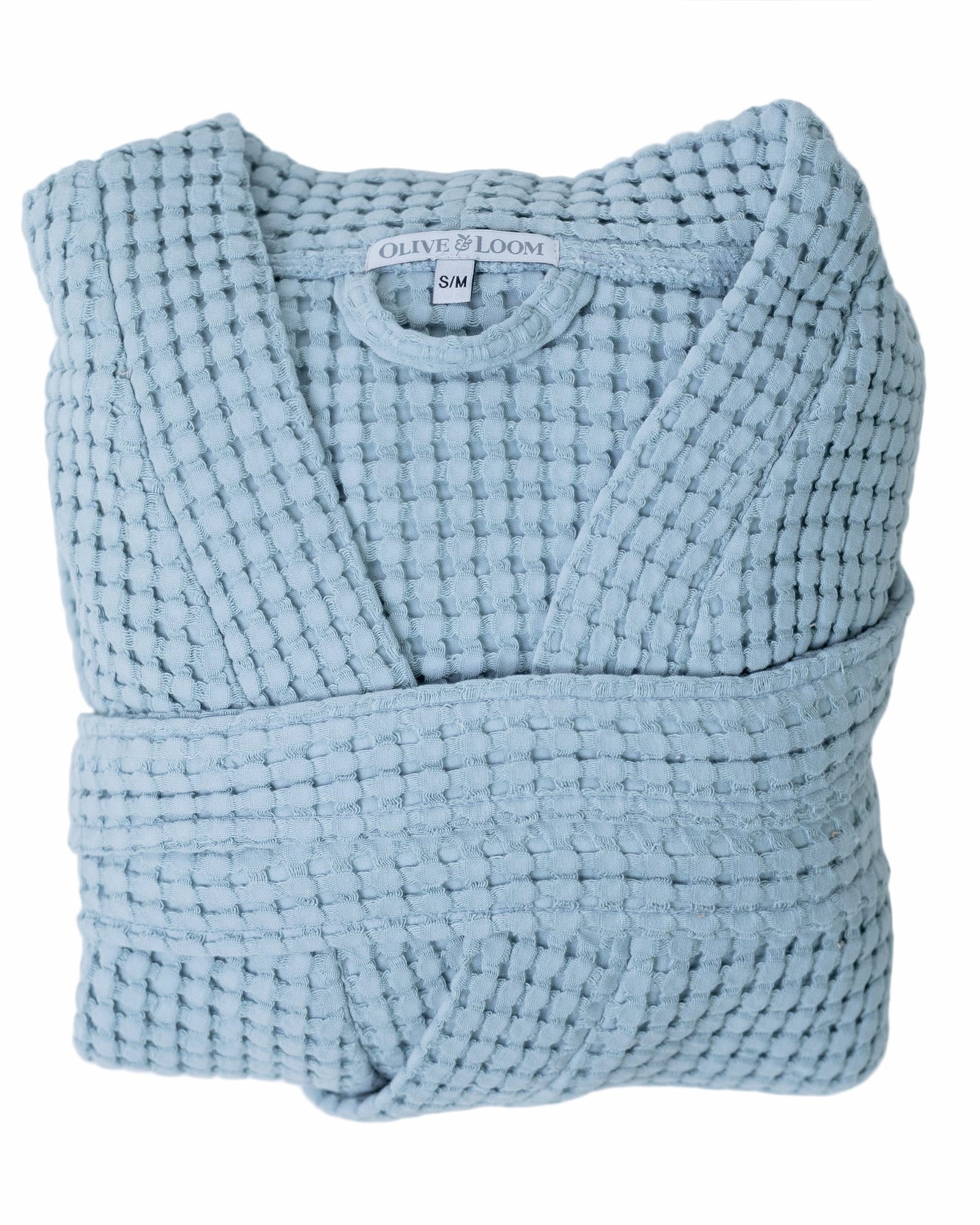 Sky blue waffle robe with a visible olive and loom brand label on a white background
