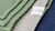 Stack of textured towels with Olive & Loom label