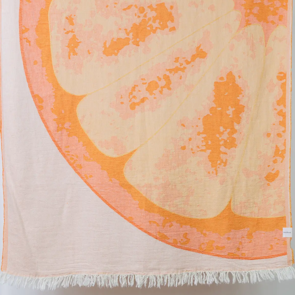 A beach towel with a fruit-inspired jacquard design