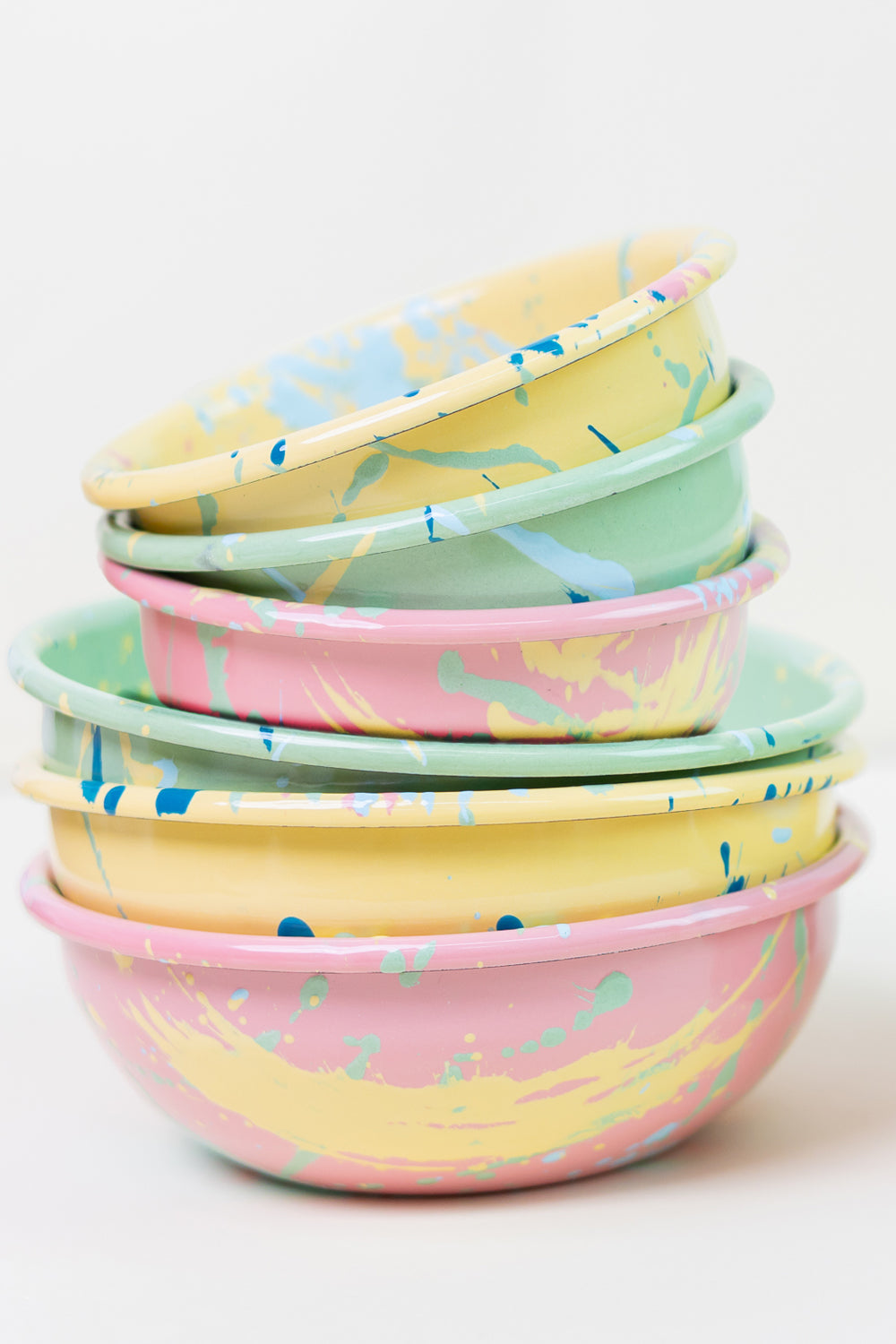 stack of enamel bowls