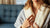 Woman wearing a white robe with a blurred background