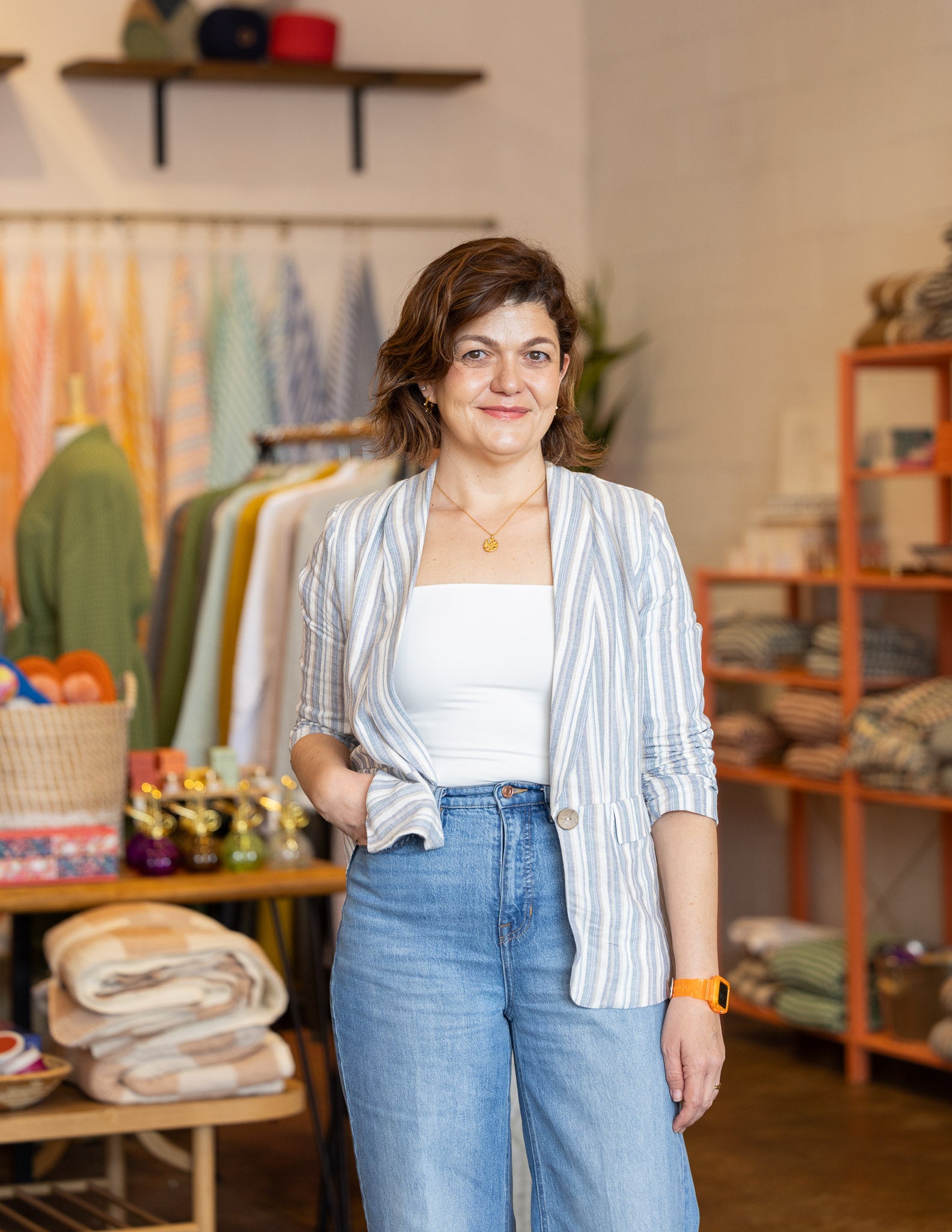 Woman posing standing in a retail gift store