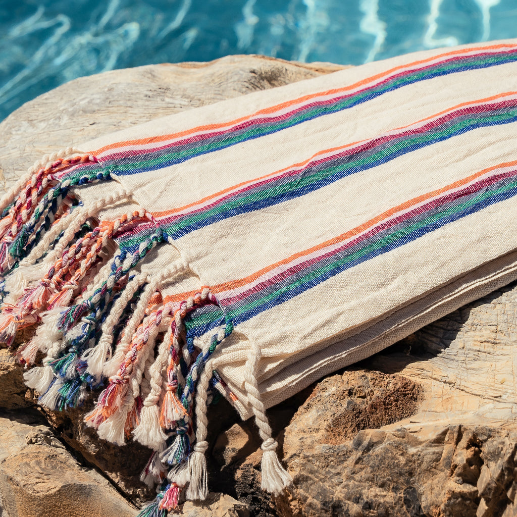 Turkish towel closeup with pool in background