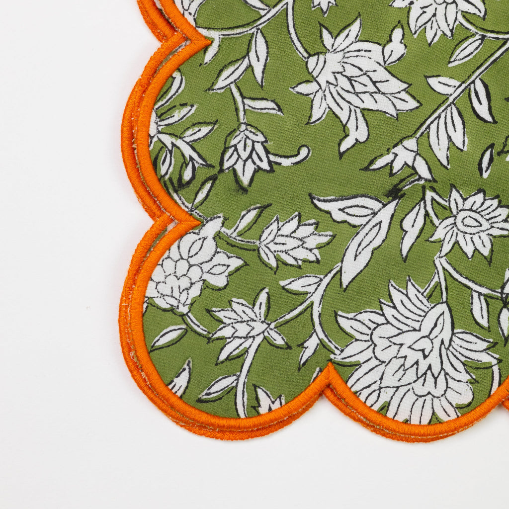 Floral patterned fabric with orange border on a white background