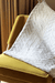 Animated image of a throw blanket tossed over a chair