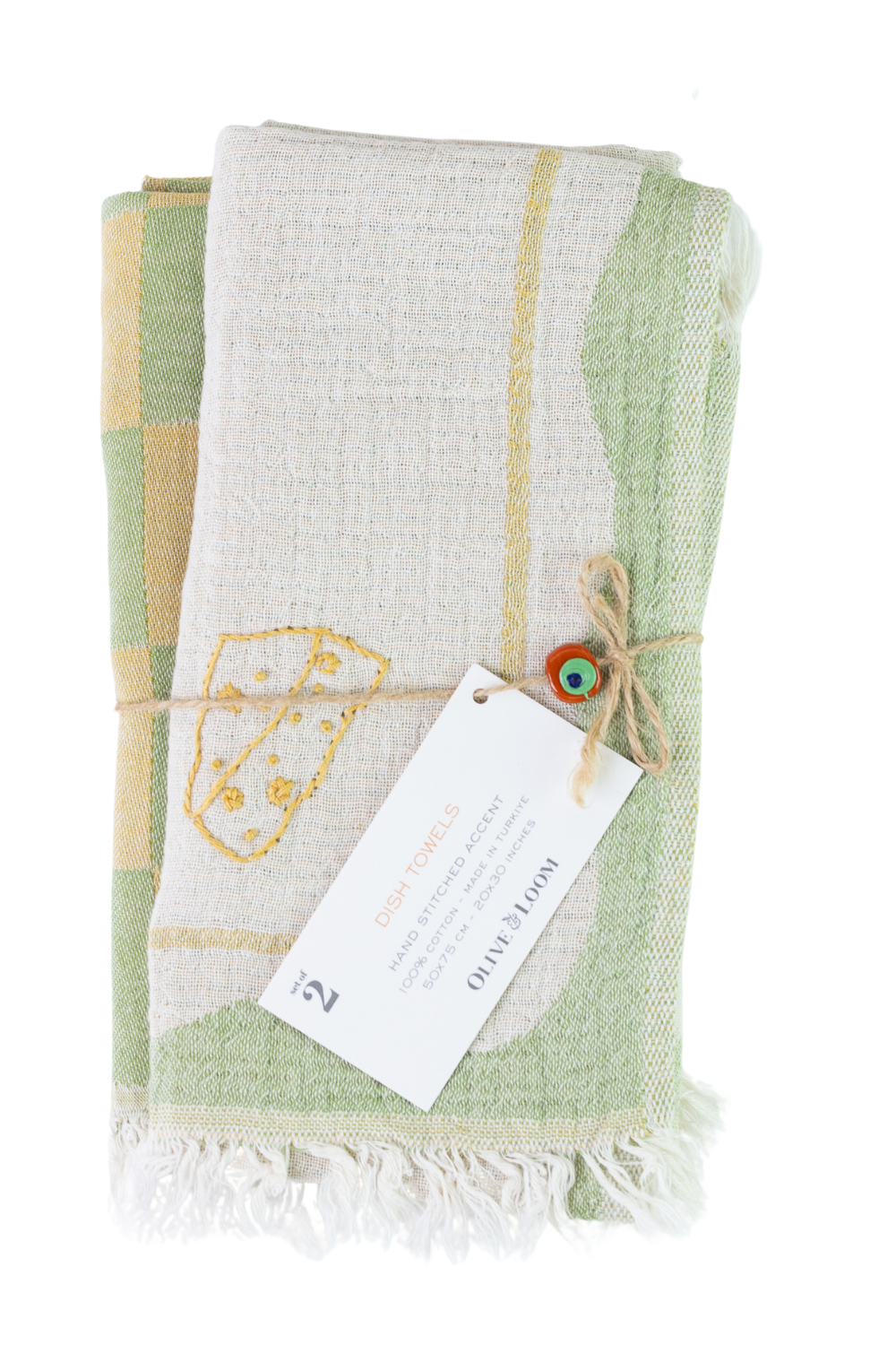 Green and white patterned towel with a tag on a white background