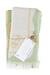Green and white patterned towel with a tag on a white background