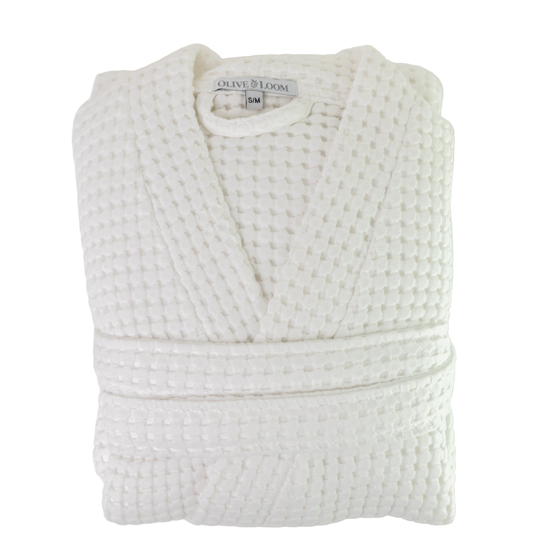 Folded waffle robe in white against a white background