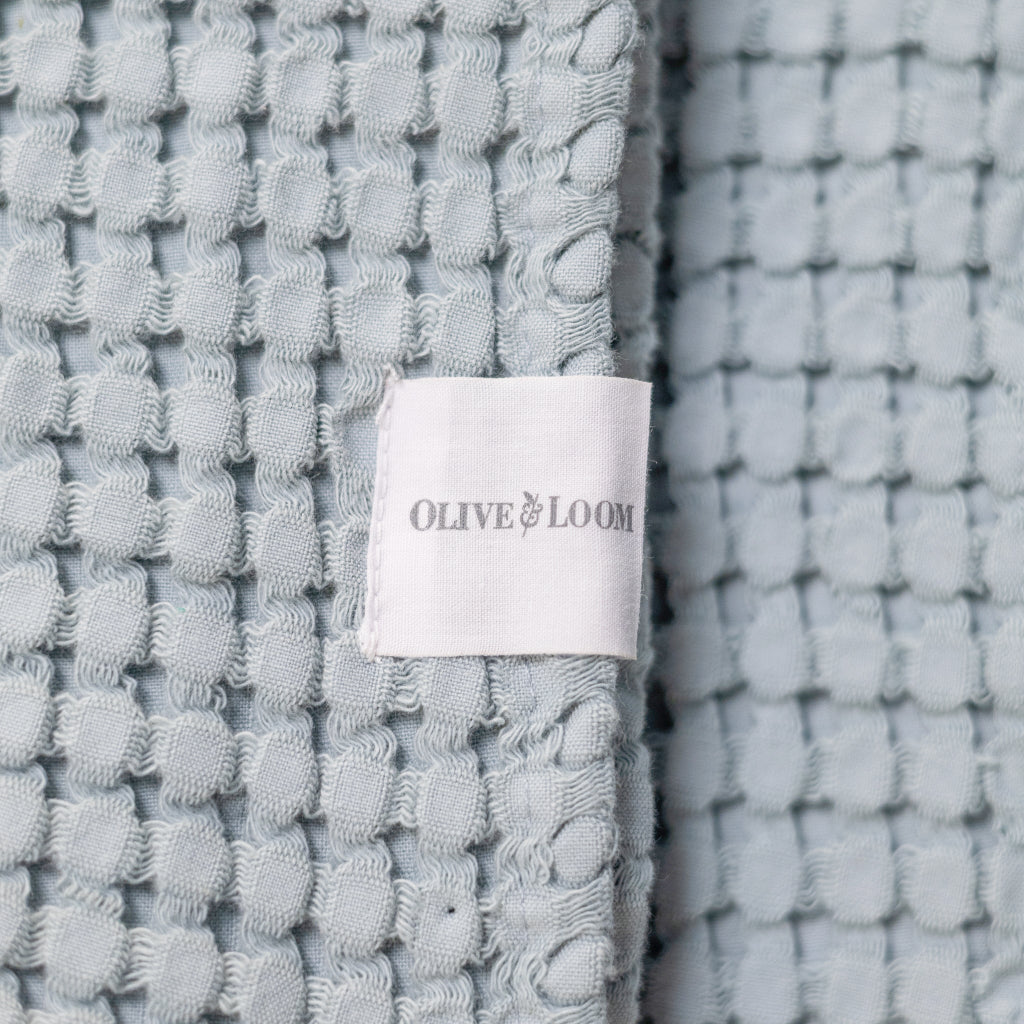 Textured fabric with Olive & Loom label