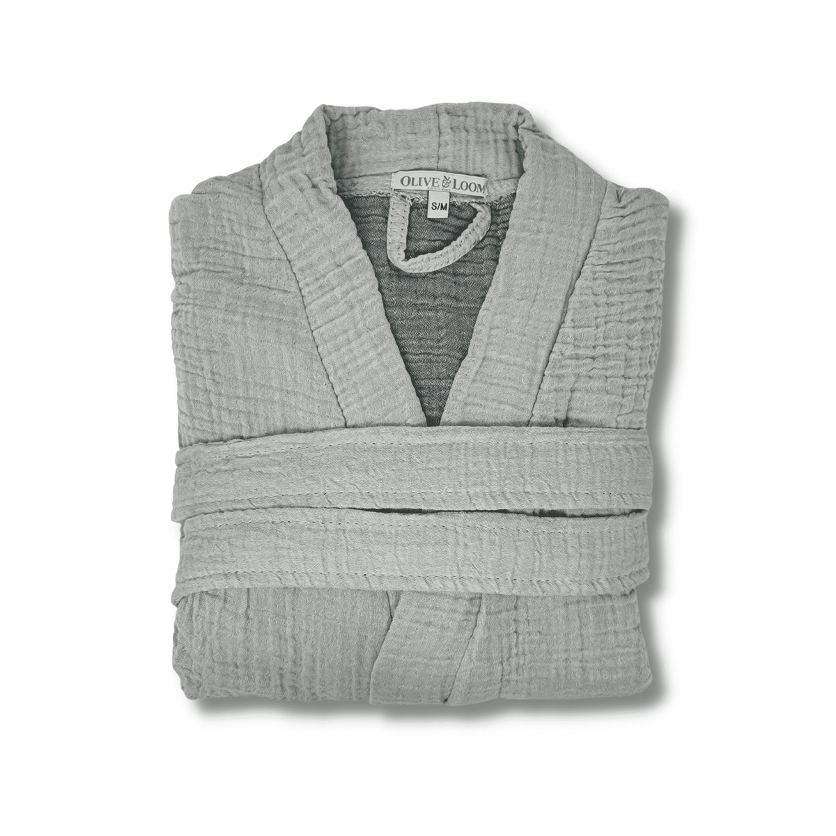 Grey muslin cotton robe folded on a white background
