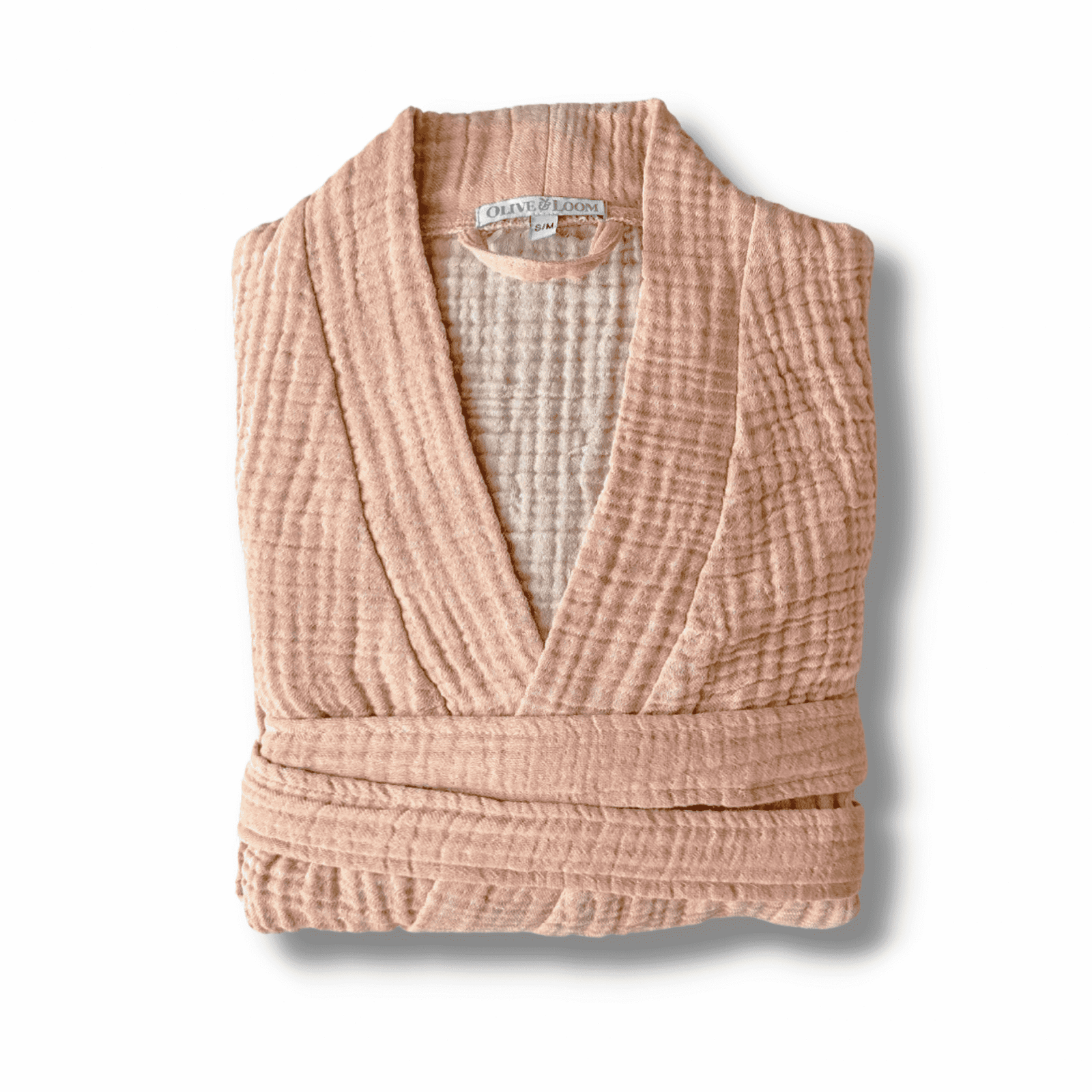 Persimmon pink muslin cotton spa robe folded on a white background