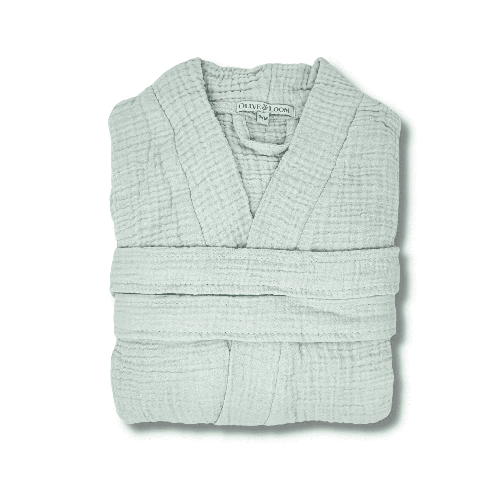 Pale sage muslin cotton spa robe folded on a white background