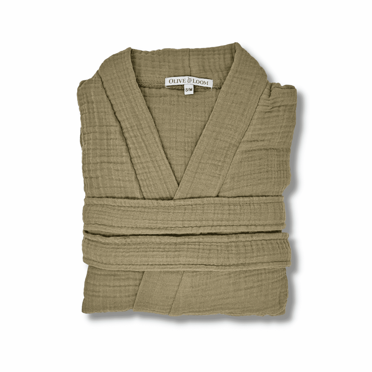 Timber brown colored muslin spa robe folded on a white background